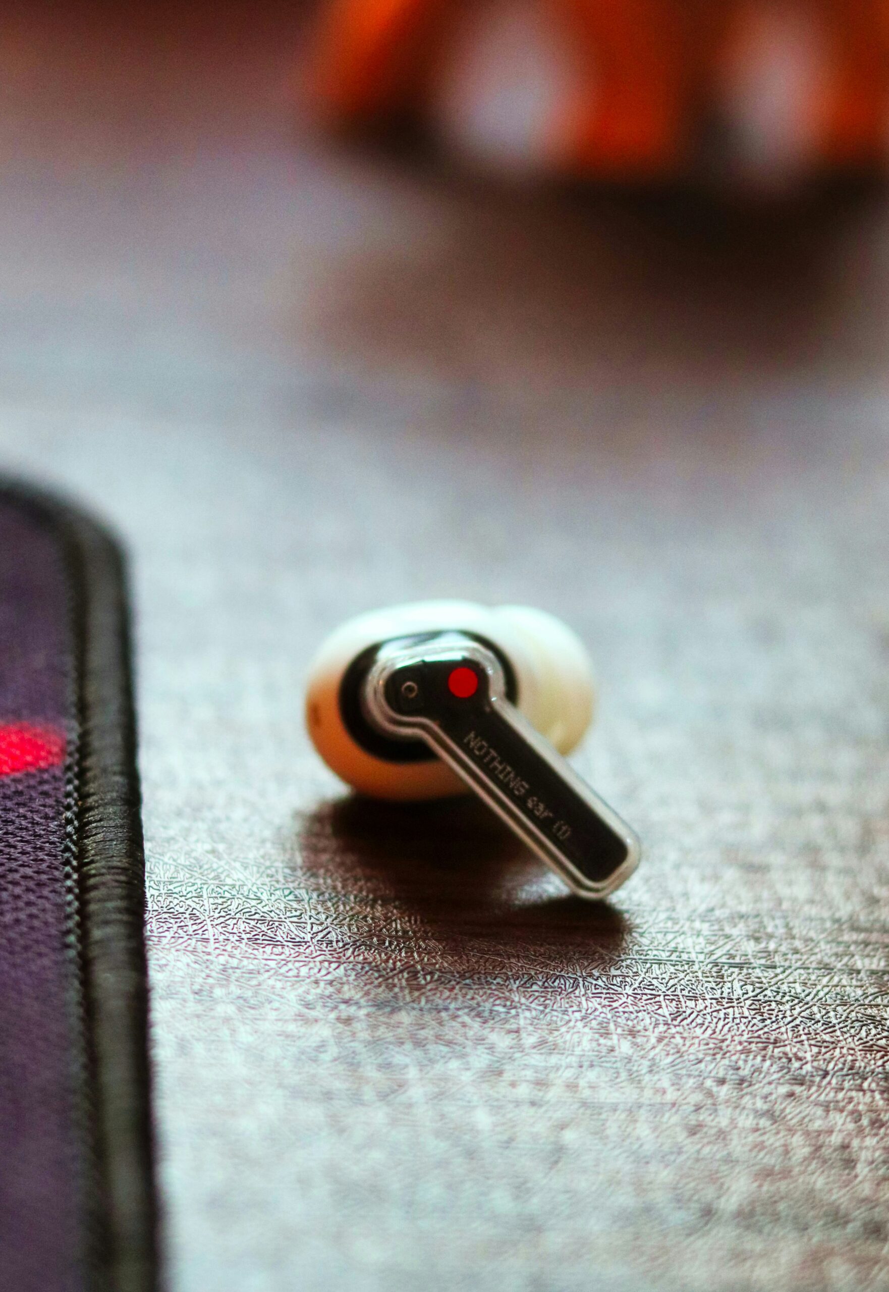 a pair of ear buds sitting on top of a table